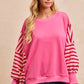 Pink BiBi French terry sweatshirt with red white striped sleeves