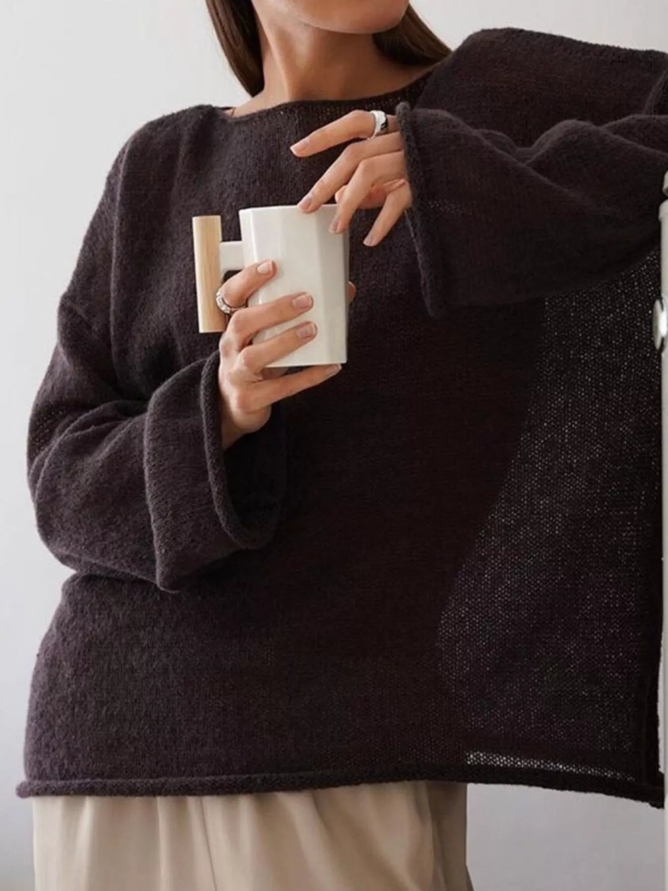 White ceramic mug with light wood handle in Boat Neck Dropped Shoulder Sweater
