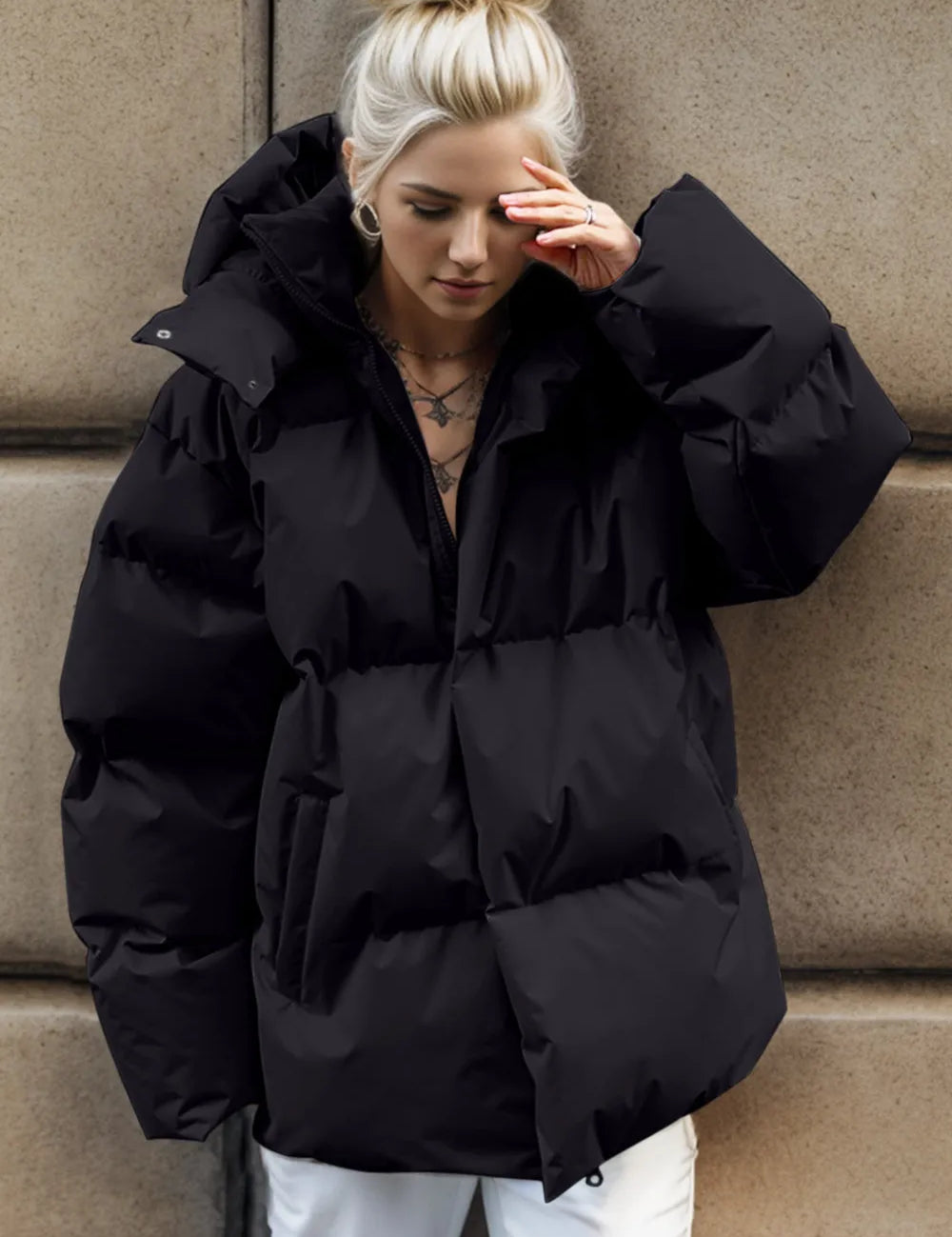 Black hooded puffer jacket with oversized sleeves and pockets