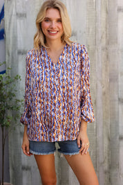 On A Wild Streak V Neck Fabric Button Detail Blouse | Daverri Fashions