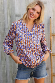 On A Wild Streak V Neck Fabric Button Detail Blouse | Daverri Fashions