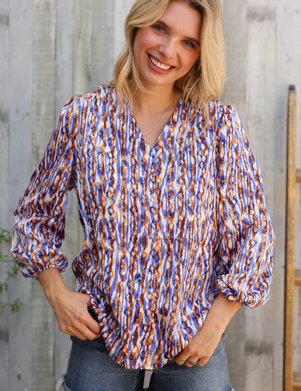On A Wild Streak V Neck Fabric Button Detail Blouse | Daverri Fashions