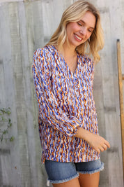 On A Wild Streak V Neck Fabric Button Detail Blouse | Daverri Fashions