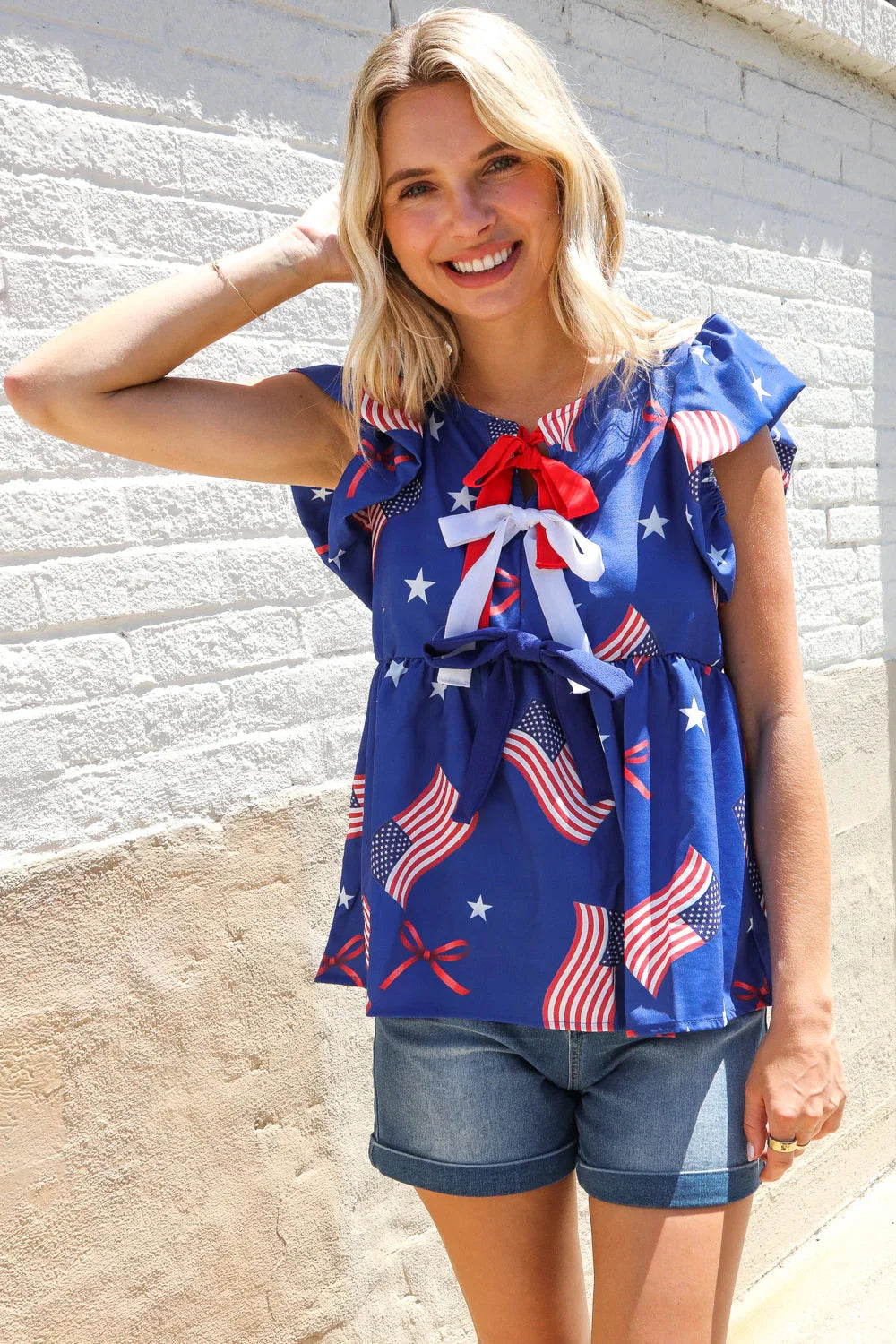 American Flag Blue & Red Stars & Bow Print Woven Top | Daverri Fashions