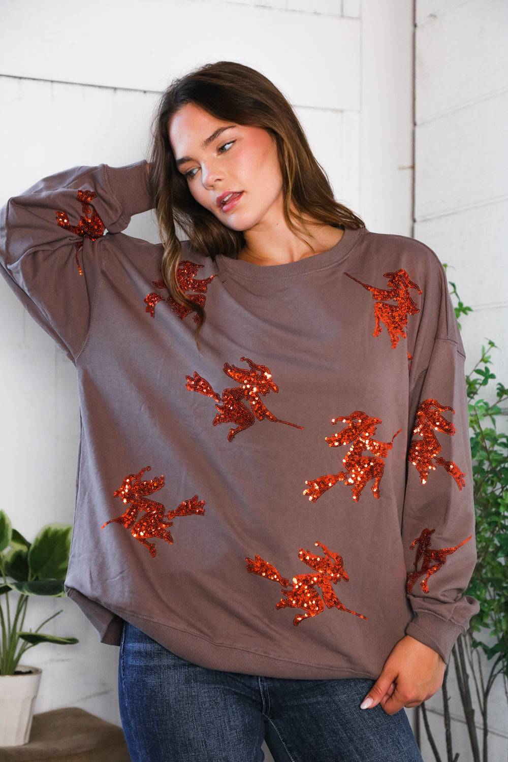 Taupe long-sleeved Sequins and Spells Spooky Pullover with orange sequin witches