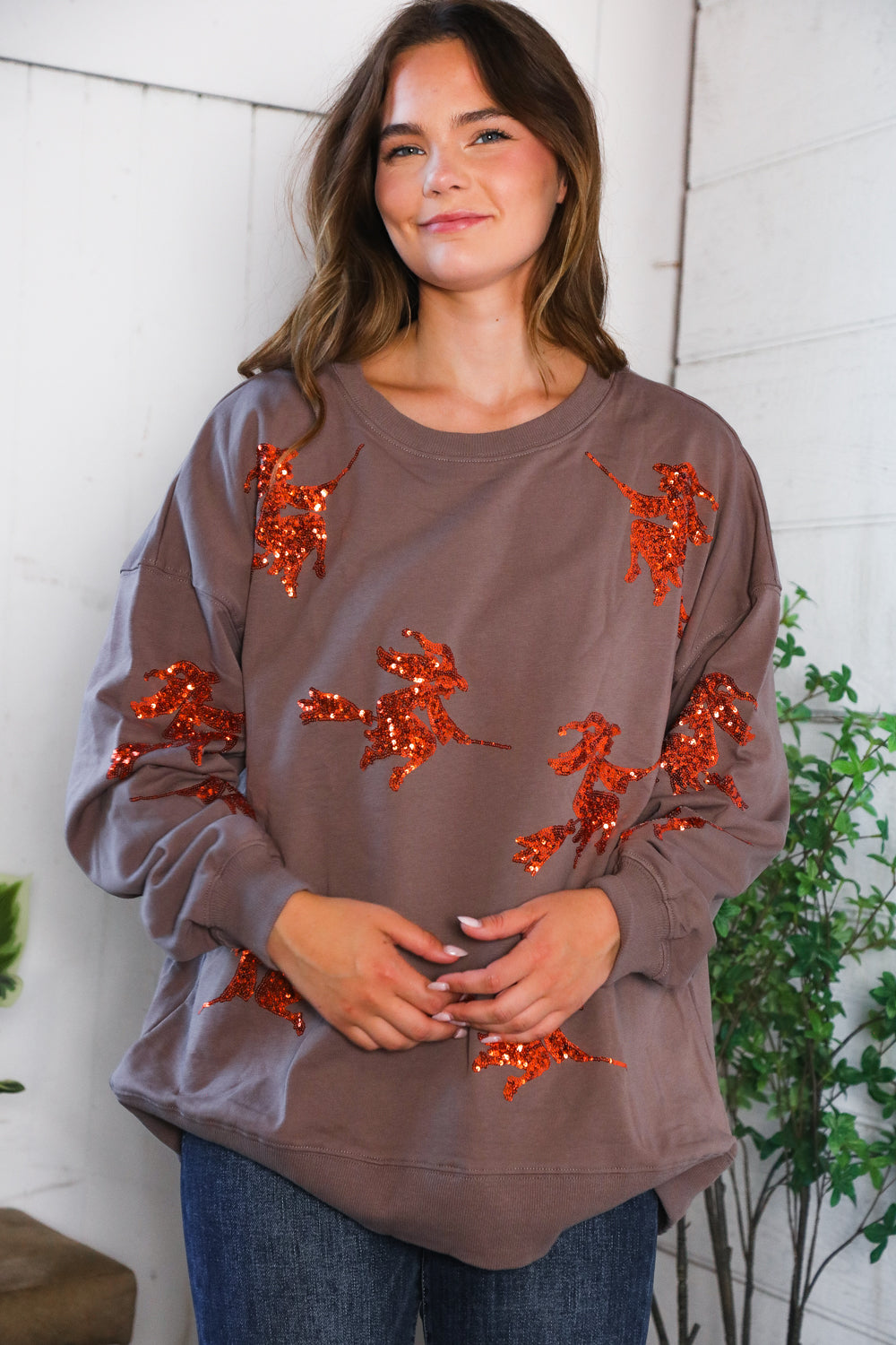 Cozy taupe Sequins and Spells Spooky Pullover with orange sequined horse appliques