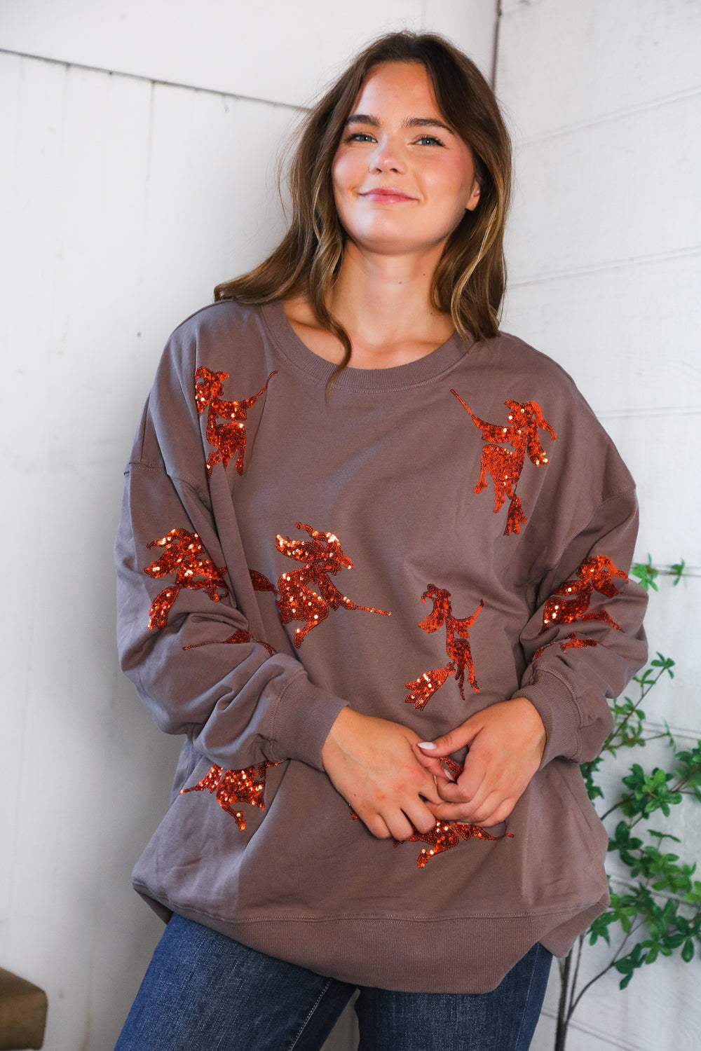 Cozy taupe Sequins and Spells Spooky Pullover with orange sequin reindeer