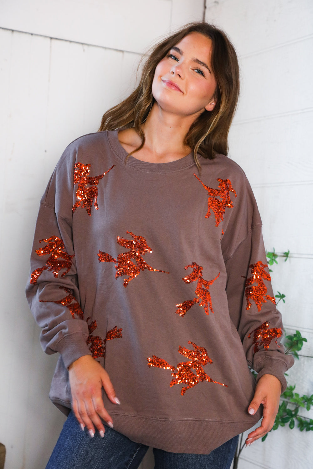Cozy taupe Sequins and Spells Spooky Pullover with orange sequin witch silhouettes