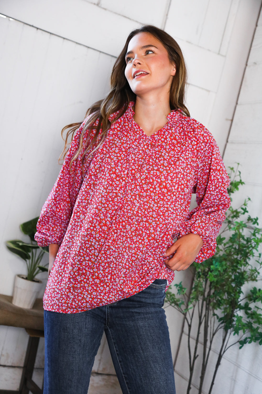Vibrant Poppy Daydream floral woven blouse with red print, flowing silhouette and rolled-up sleeves