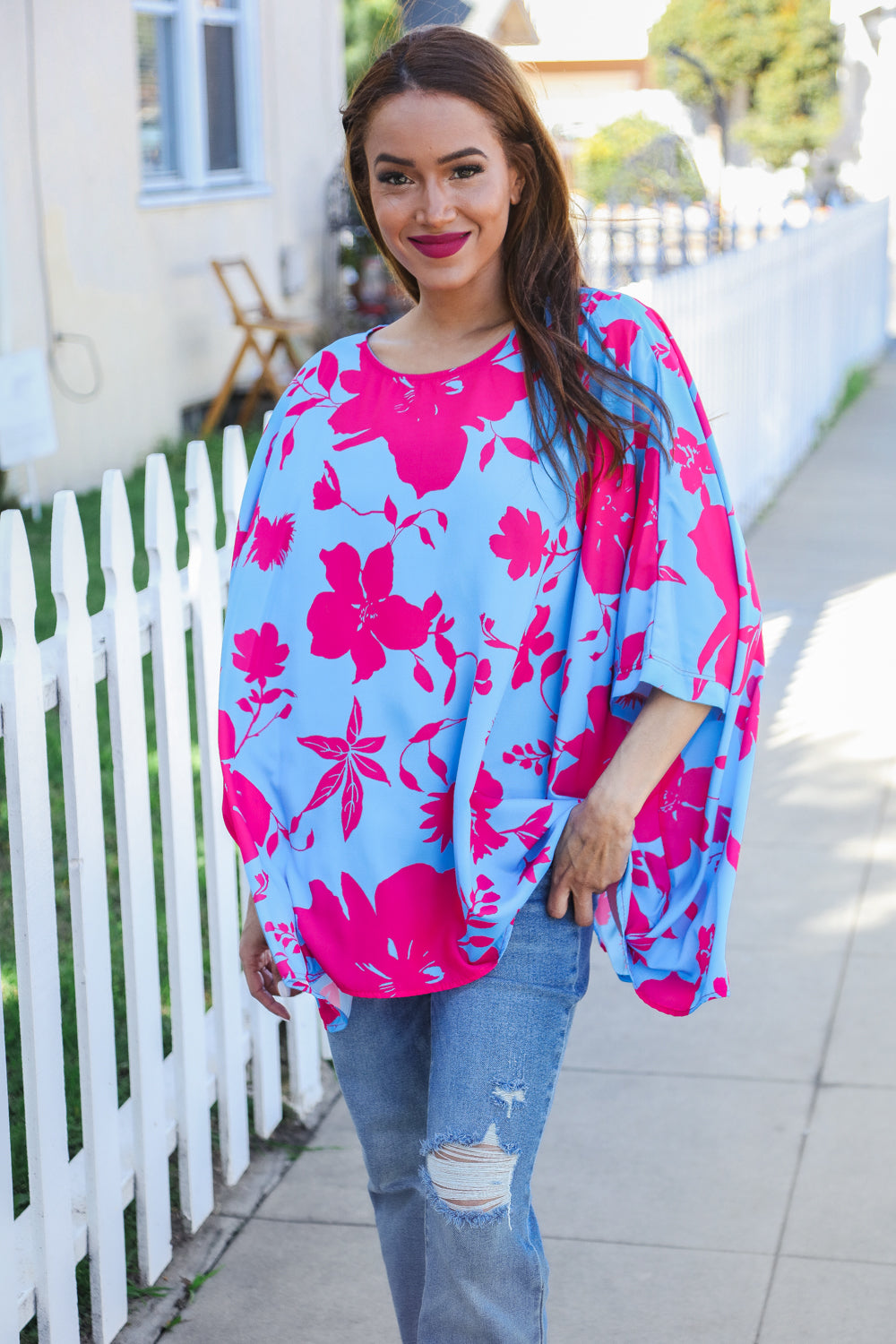 Vibrant fuchsia floral asymmetrical coverup blouse with cape-style top and flowing sleeves