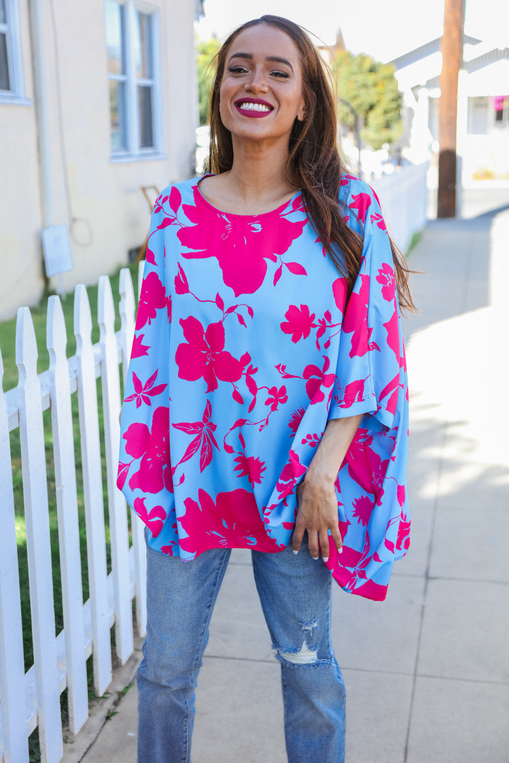 Vibrant Follow Me fuchsia floral asymmetrical coverup blouse in blue with pink patterns and wide sleeves