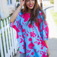 Vibrant fuchsia floral asymmetrical coverup blouse with blue pink print and flowing sleeves