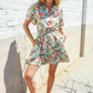 Get Whimsical Tropical Print Smocked Waist Neck Button Romper - DAVERRI FASHIONS