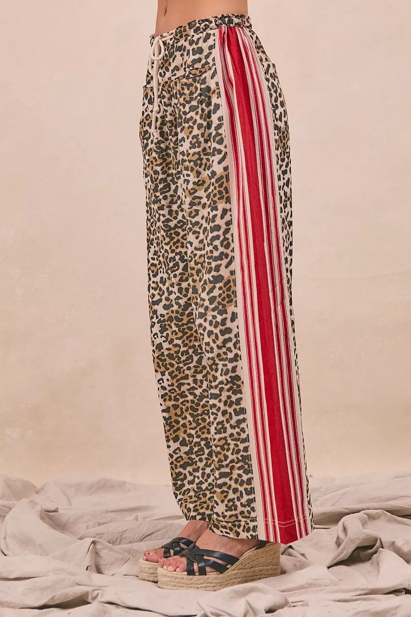 BiBi Leopard Print Pants with red-white side stripes and welt pockets