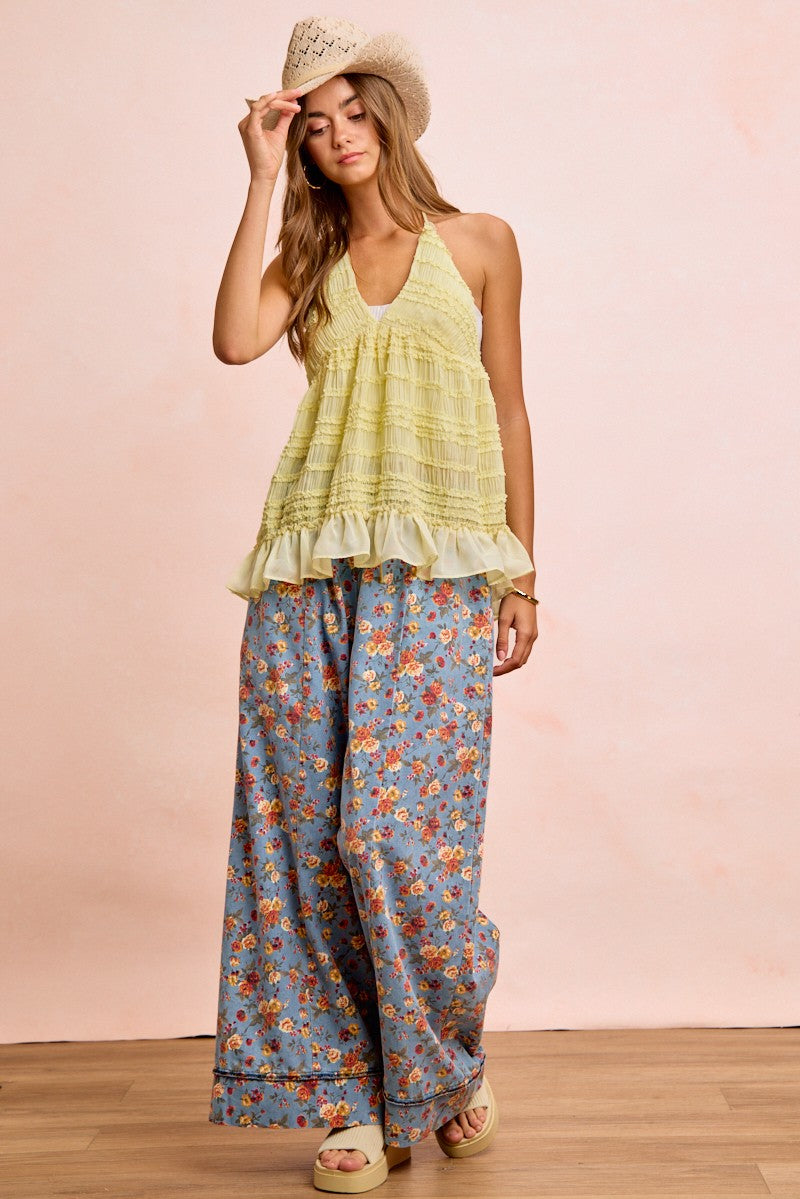 Woman in BiBi Floral Printed Drawstring Wide Pants, light green ruffled halter top