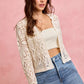 Cream-colored crochet knit long sleeves lace cardigan with openwork pattern