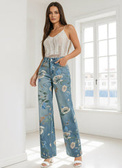 Woman wearing floral jeans and a white top in a bright room.