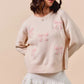 SO ME cream knit sweater with pink embroidered bows