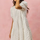 White textured lace tiered mini dress with puffed sleeves