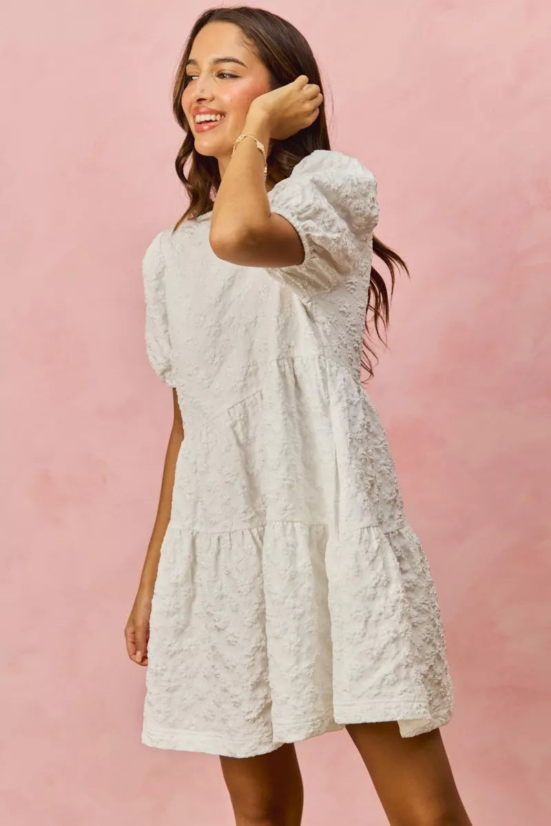 White textured lace tiered mini dress with puffed sleeves
