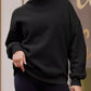 Black oversized mock neck sweatshirt with ribbed cuffs and hem
