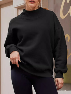 Black oversized mock neck sweatshirt with ribbed cuffs and hem