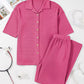 Pink waffle-knit pajama set with short sleeve button-front shirt and pants