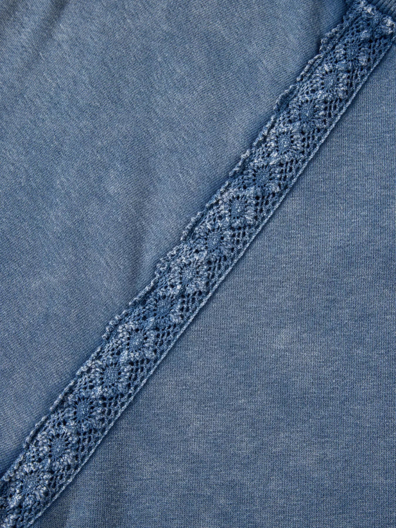 Blue denim baggy sweatshirt with diagonal lace patchwork trim