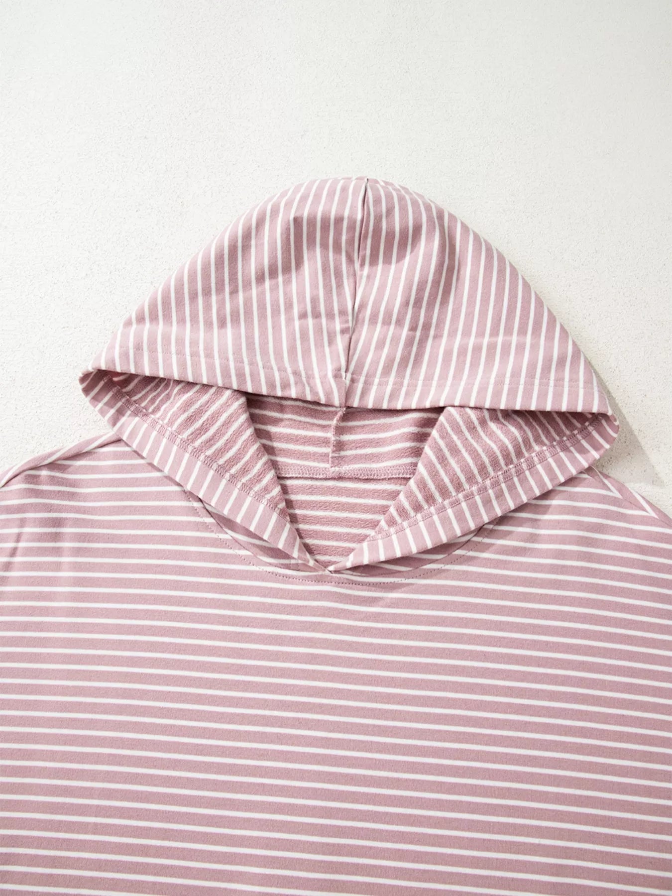 Dusty pink striped thumbhole hoodie with side slits and drop shoulders
