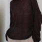 Boat neck dropped shoulder sweater in loose dark brown knit with sheer texture