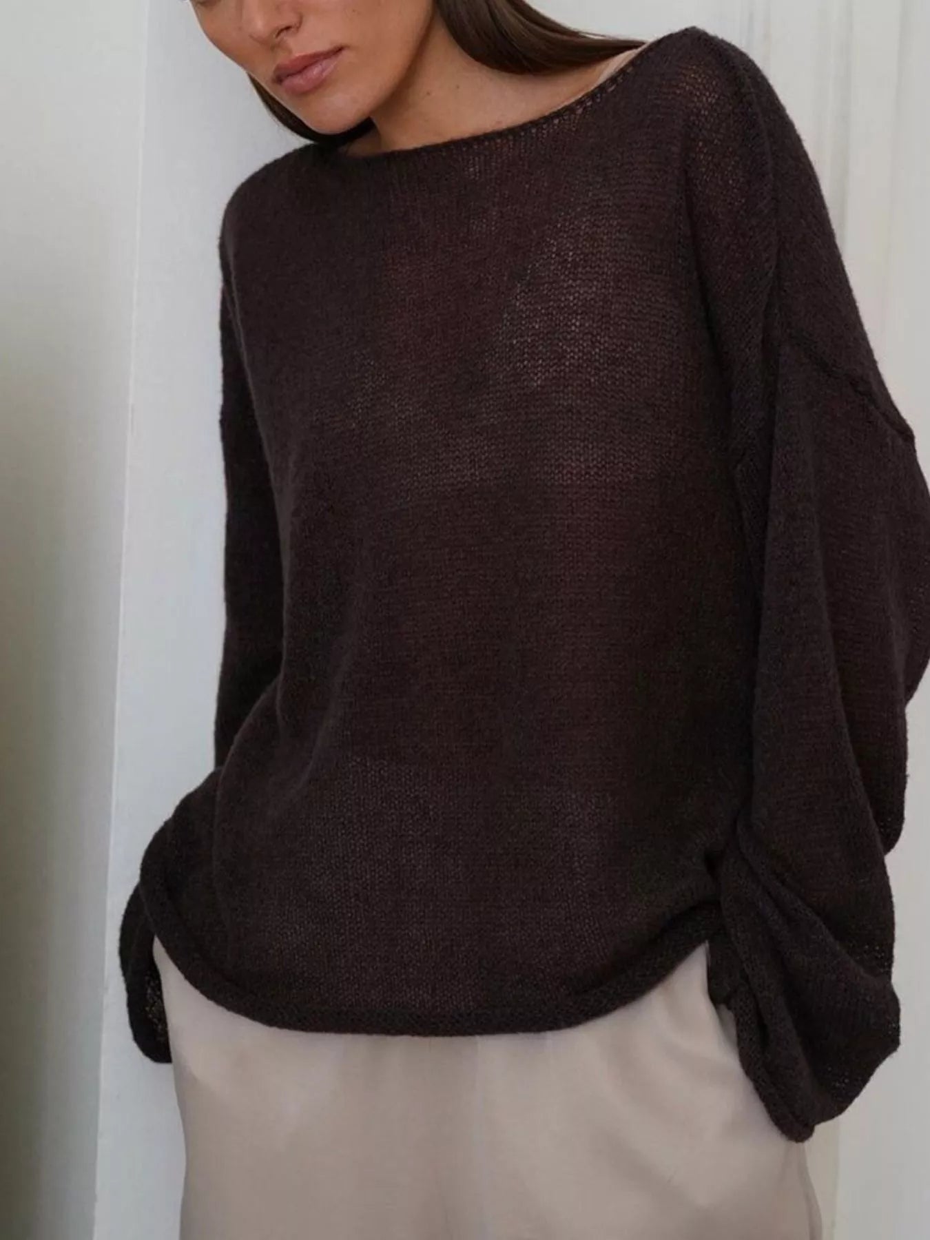 Boat neck dropped shoulder sweater in loose dark brown knit with sheer texture