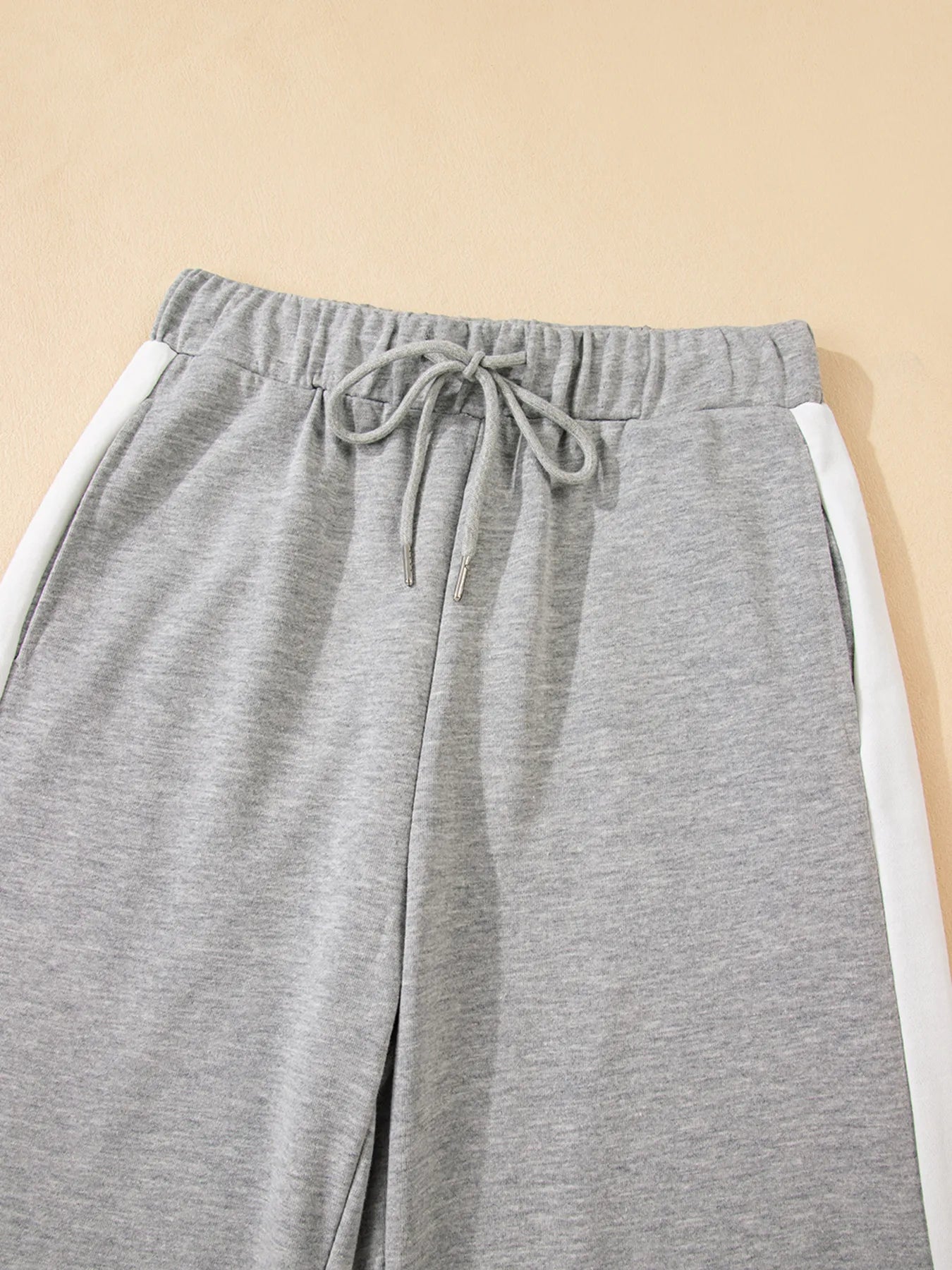 Gray sweatpants with white side stripes in Daverri Fashions set