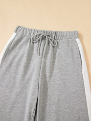 Gray sweatpants with white side stripes in Daverri Fashions set