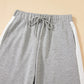 Gray sweatpants with white side stripes in Daverri Fashions set