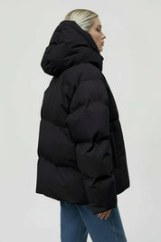 Black pocketed zip-up hooded puffer jacket with quilted synthetic design