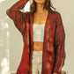 Cozy oversized red black tie-dye ribbed knit V-neck cardigan