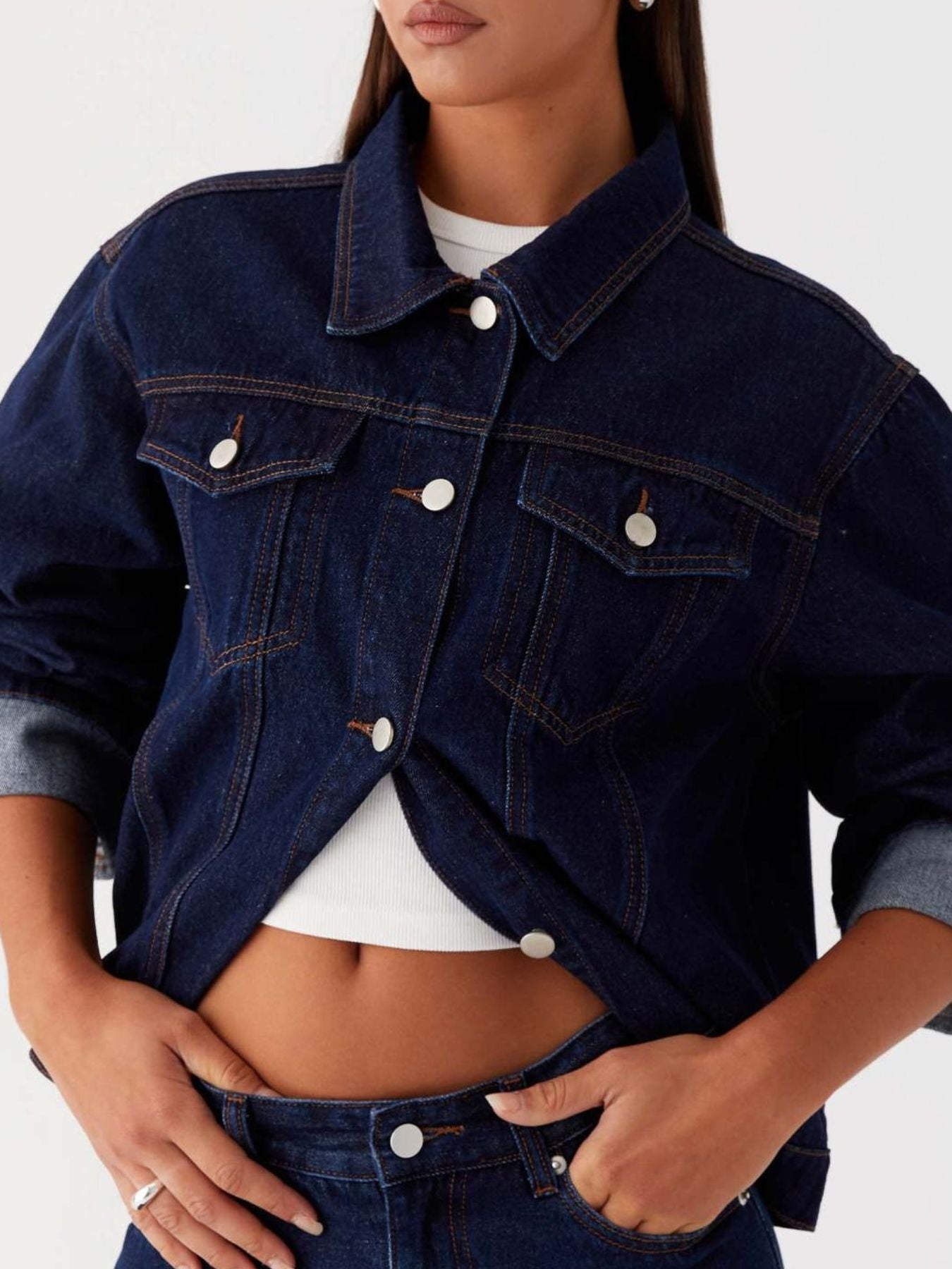 Daverri cropped oversized denim jacket in dark blue with white buttons and rolled sleeves