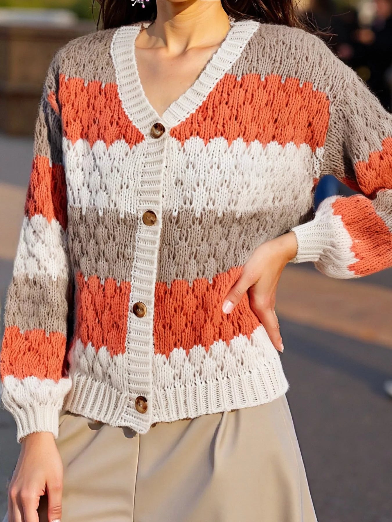 Cozy color block button-up cardigan in coral orange and cream stripes