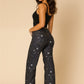 Women’s low rise rhinestone jeans with starry night sky pattern