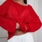 Vibrant red boat neck dropped shoulder knit sweater with sheer mesh chest panel