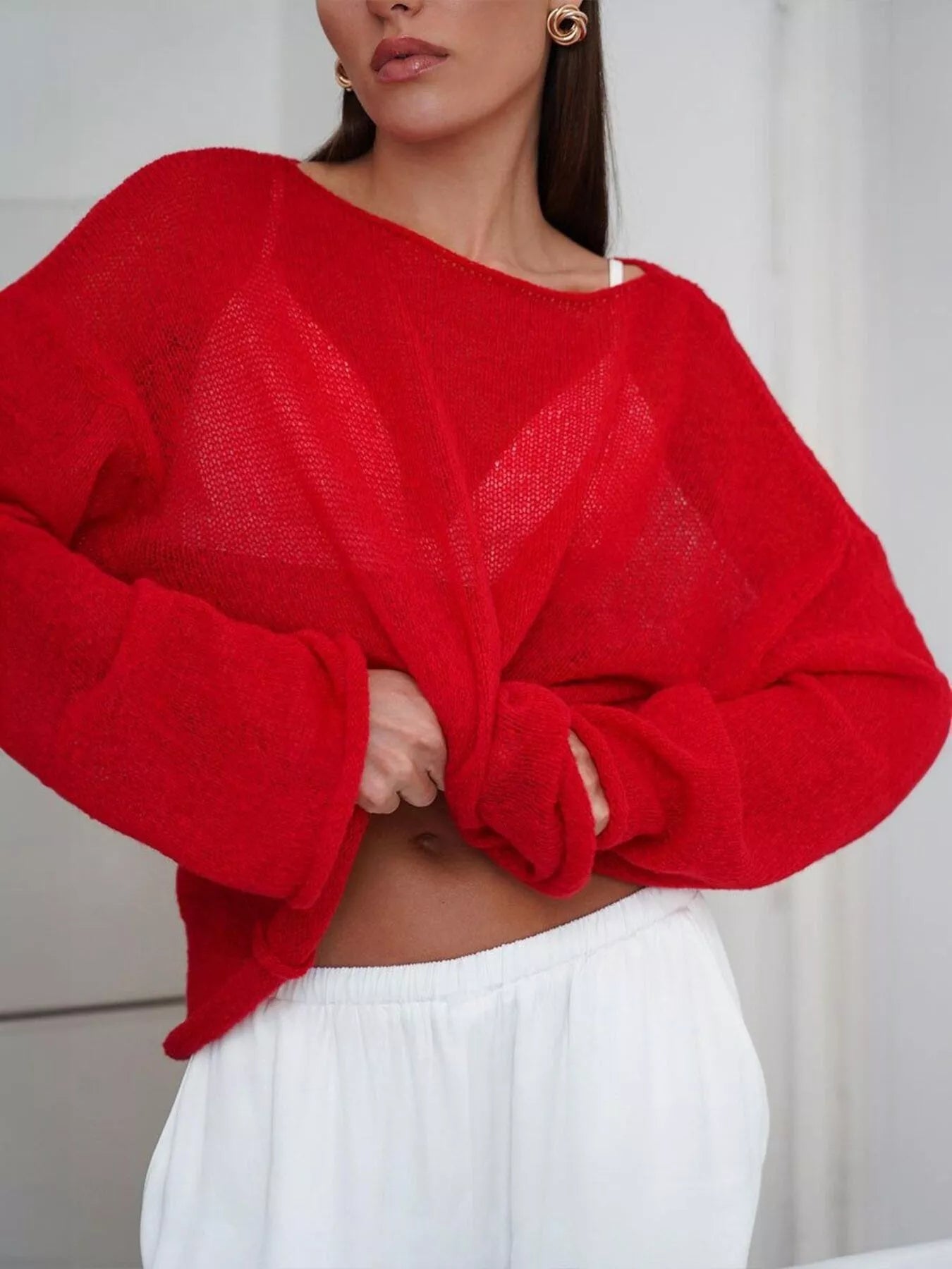 Vibrant red boat neck dropped shoulder knit sweater with sheer mesh chest panel