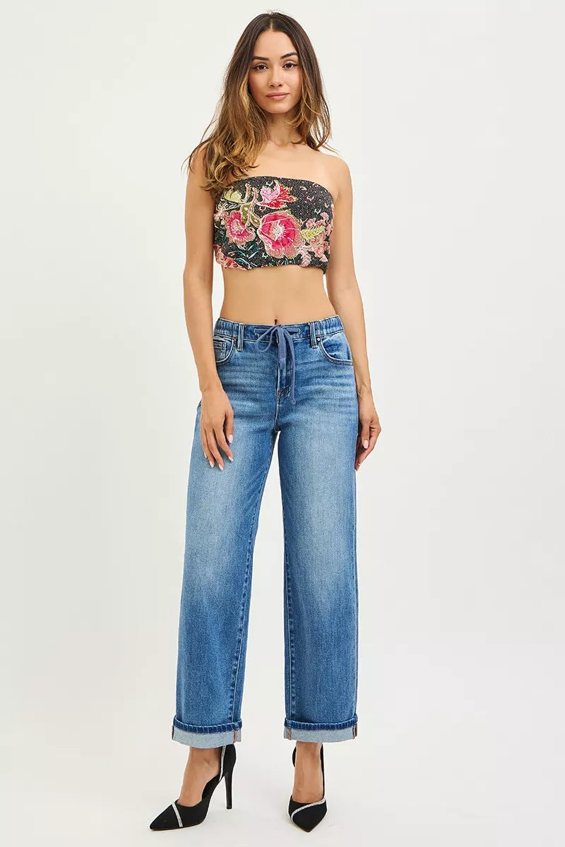 Black strapless crop top with pink red green floral embroidery on RISEN boyfriend jeans