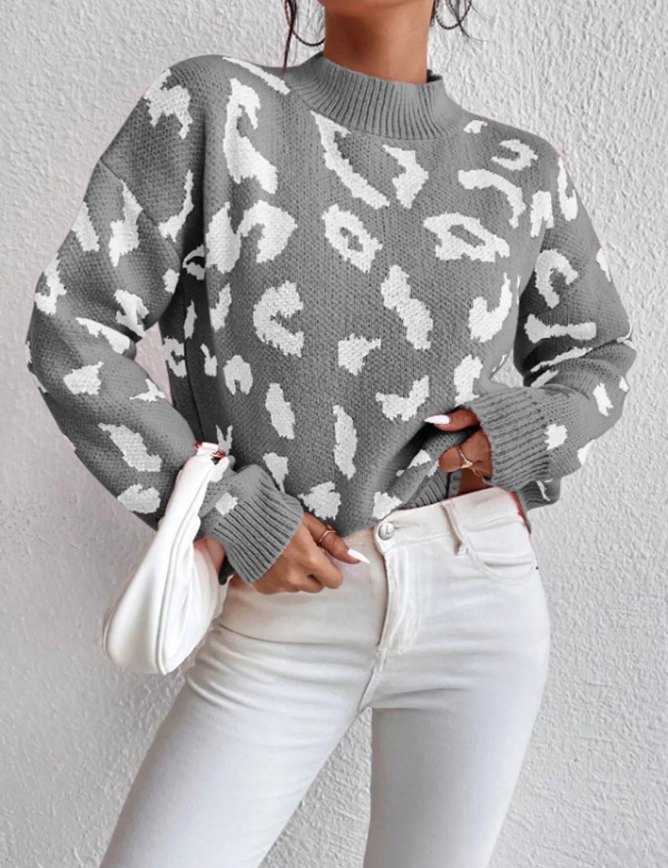 Leopard print mock neck sweater with balloon sleeves on gray background