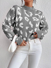 Leopard print mock neck sweater with balloon sleeves on gray background