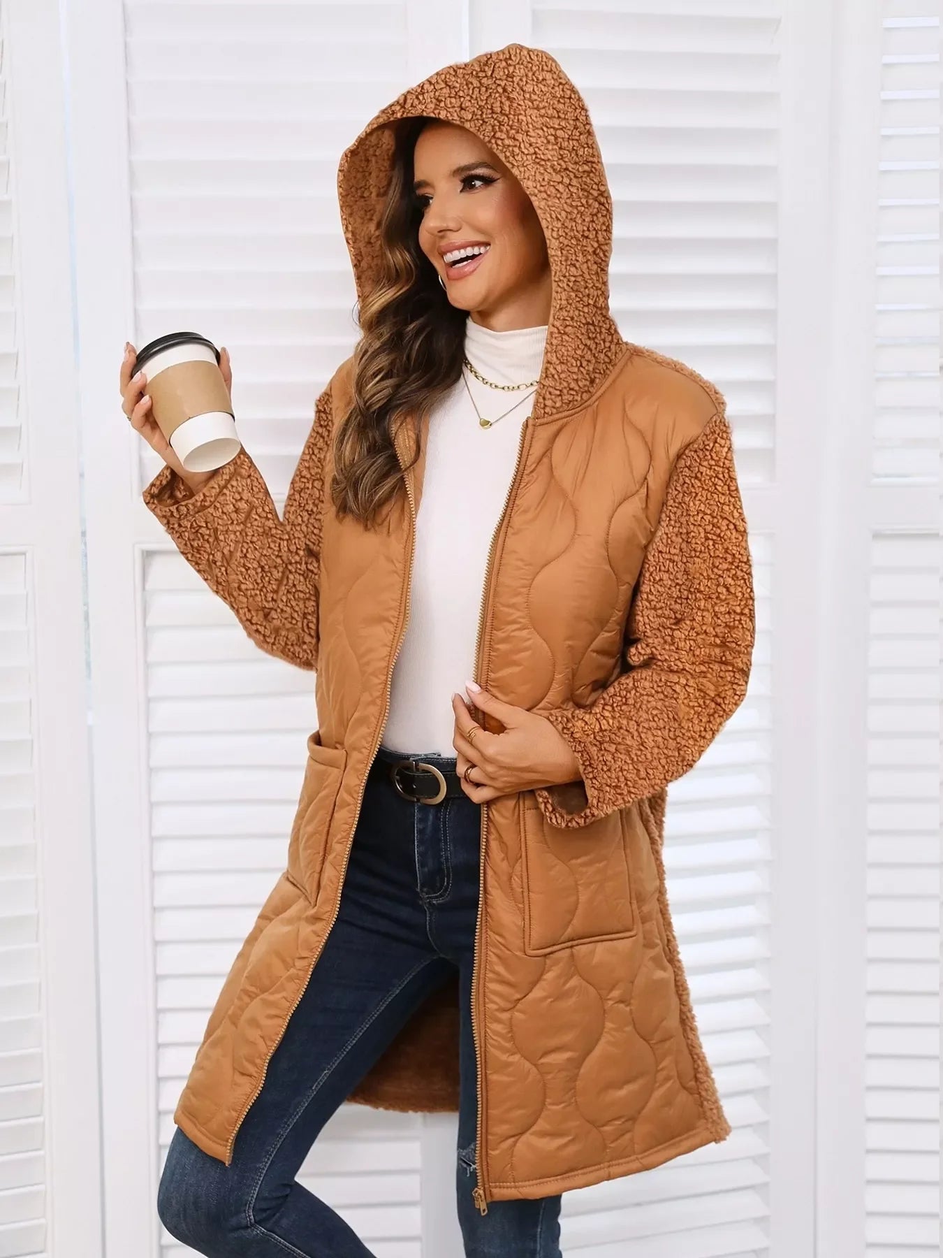 Brown zip-up hooded coat with quilted sherpa lining and pockets