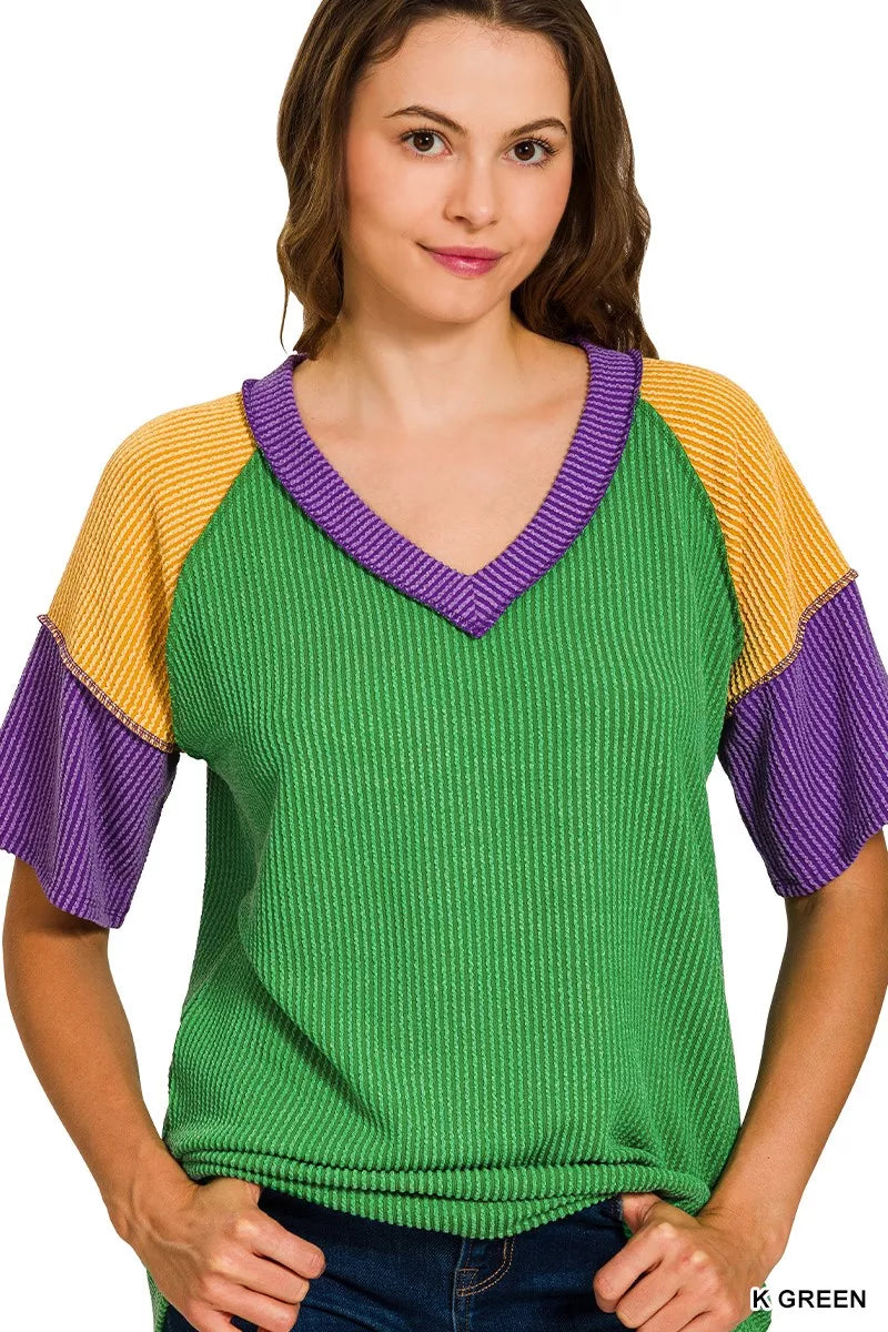 Green ribbed knit Zenana Mardi Gras color block top with purple and yellow raglan sleeves