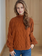 Rust-colored cable-knit turtleneck sweater with bell sleeves