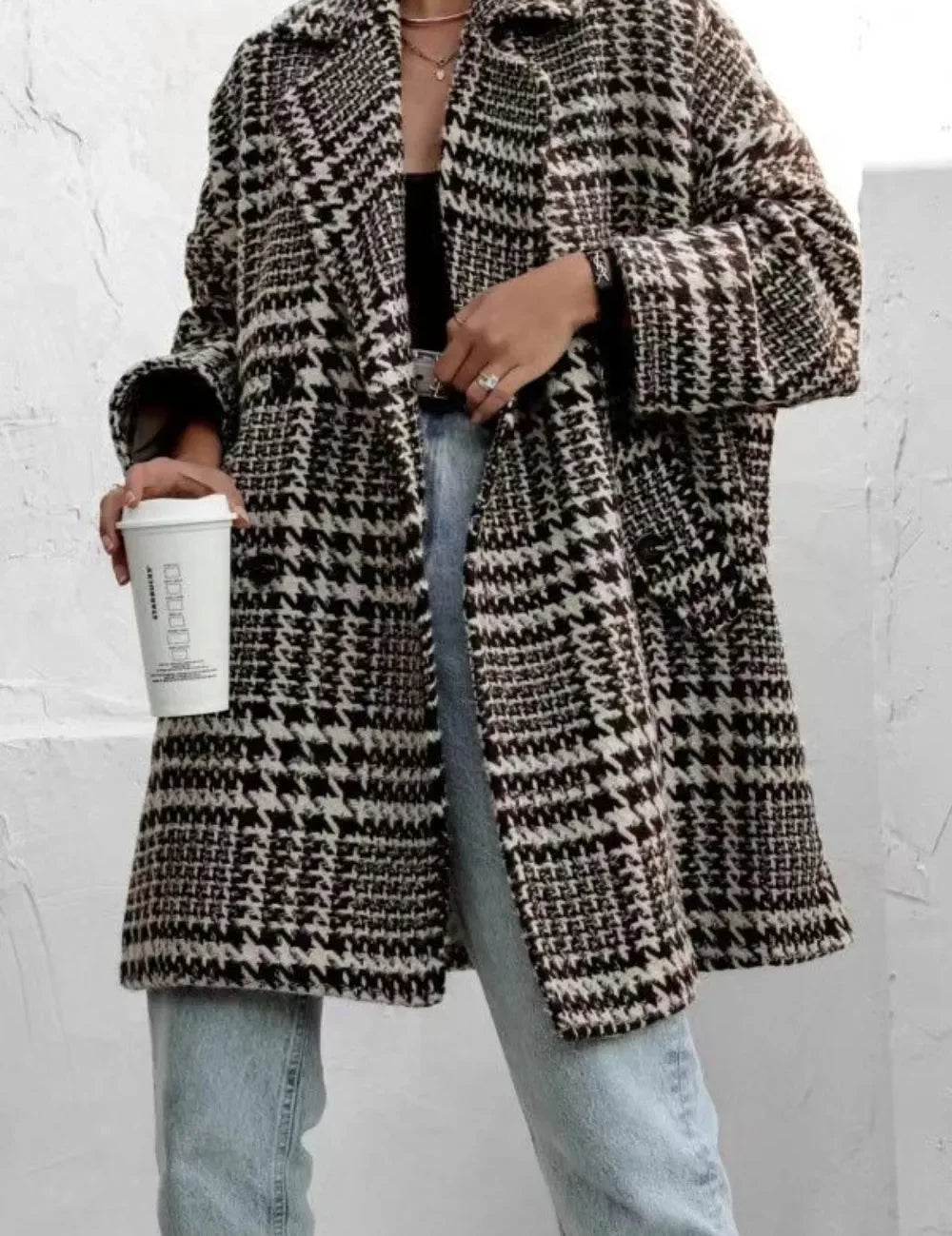 Houndstooth wool coat with black white checkered pattern and pockets