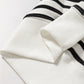 White ribbed knit oversized sweatshirt with black stripes and raglan sleeves