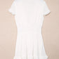 White short-sleeved A-line tie-front mini dress with smocked waist, flared skirt and ruffled hem